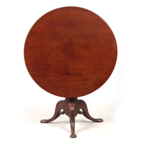 1269 - A GEORGE III MAHOGANY TILT TOP TABLE with a one-piece circular top, standing on gun barrel turned st... 