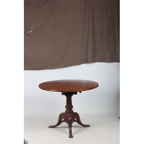 1269 - A GEORGE III MAHOGANY TILT TOP TABLE with a one-piece circular top, standing on gun barrel turned st... 