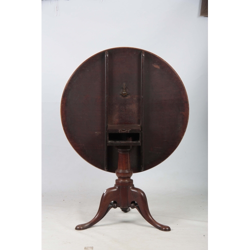 1269 - A GEORGE III MAHOGANY TILT TOP TABLE with a one-piece circular top, standing on gun barrel turned st... 