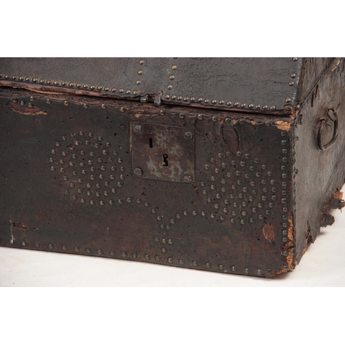 1274 - AN 18TH CENTURY DOME TOPPED LEATHER STUDDED TRUNK with hinged lid and side carrying handles 102cm wi... 