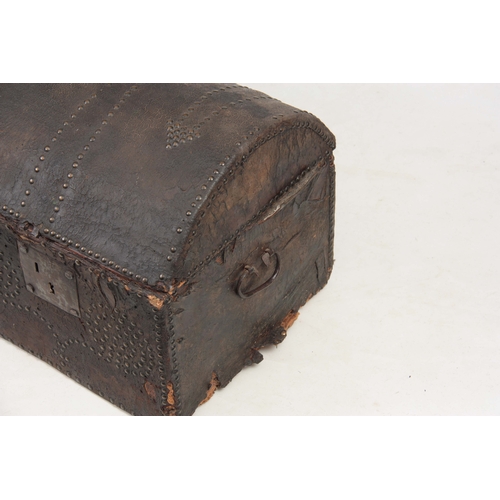 1274 - AN 18TH CENTURY DOME TOPPED LEATHER STUDDED TRUNK with hinged lid and side carrying handles 102cm wi... 