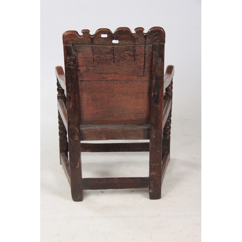 1281 - AN 18TH CENTURY OAK WAINSCOT CHAIR OF SMALL PROPORTIONS having carved back, dated 1731 with open arm... 