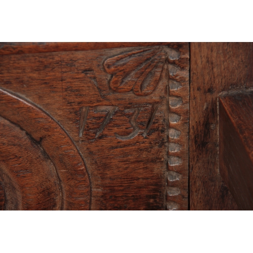 1281 - AN 18TH CENTURY OAK WAINSCOT CHAIR OF SMALL PROPORTIONS having carved back, dated 1731 with open arm... 