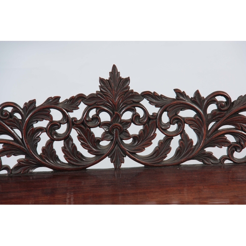 1282 - A PAIR OF 19TH CENTURY ANGLO-INDIAN CARVED ROSEWOOD CONSOLE TABLES having pierced foliate ledge back... 