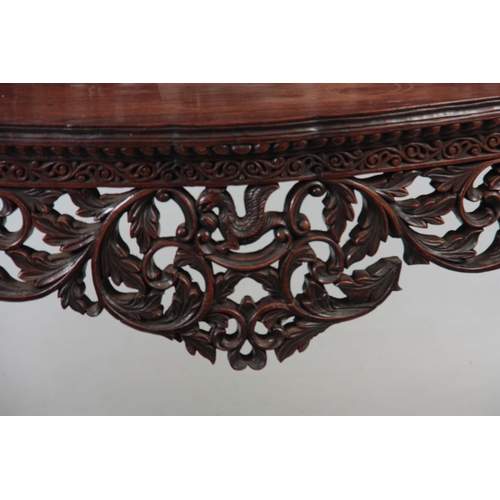 1282 - A PAIR OF 19TH CENTURY ANGLO-INDIAN CARVED ROSEWOOD CONSOLE TABLES having pierced foliate ledge back... 