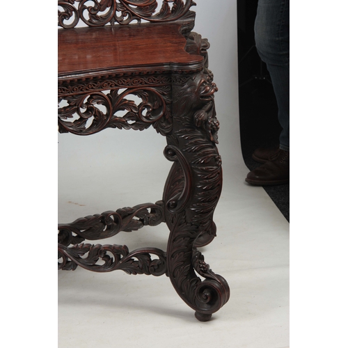 1282 - A PAIR OF 19TH CENTURY ANGLO-INDIAN CARVED ROSEWOOD CONSOLE TABLES having pierced foliate ledge back... 