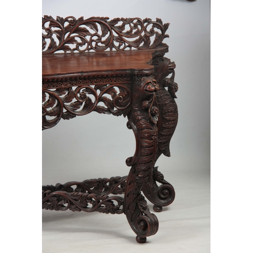 1282 - A PAIR OF 19TH CENTURY ANGLO-INDIAN CARVED ROSEWOOD CONSOLE TABLES having pierced foliate ledge back... 