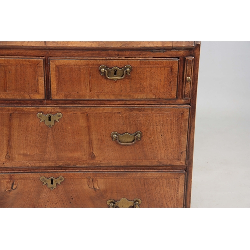 1283 - A SMALL EARLY 18TH CENTURY WALNUT BUREAU having an angled hinged fall revealing an interior of small... 