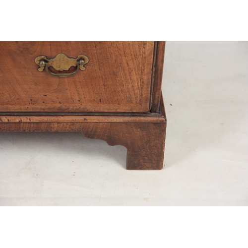 1283 - A SMALL EARLY 18TH CENTURY WALNUT BUREAU having an angled hinged fall revealing an interior of small... 