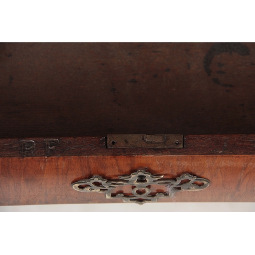 1285 - AN EARLY 18TH CENTURY FIGURED WALNUT MIRRORED CABINET ON CHEST with hinged door revealing a shelved ... 