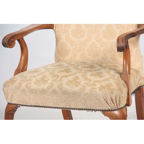 1291 - A GEORGE I STYLE WALNUT UPHOLSTERED ARM CHAIR with arched shaped back above sweeping scrolled arms; ... 