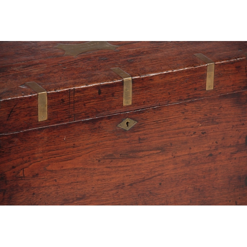 1294 - AN 18TH CENTURY CAMPHORWOOD OFFICERS TRUNK with brass corners, strapwork and fitted side handles; wi... 