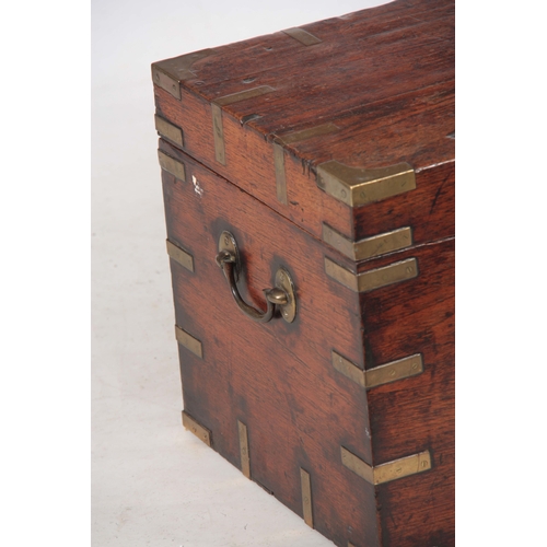 1294 - AN 18TH CENTURY CAMPHORWOOD OFFICERS TRUNK with brass corners, strapwork and fitted side handles; wi... 