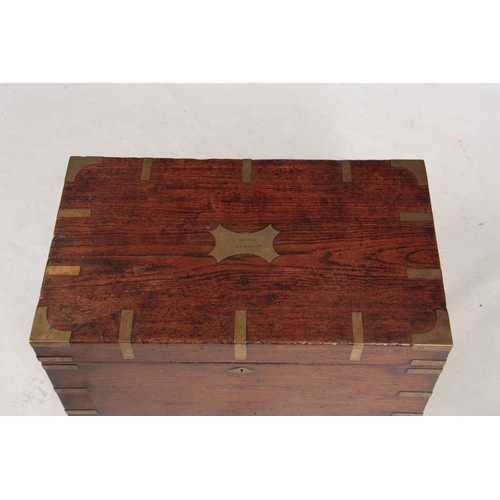 1294 - AN 18TH CENTURY CAMPHORWOOD OFFICERS TRUNK with brass corners, strapwork and fitted side handles; wi... 