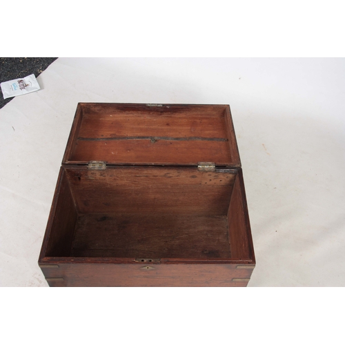 1294 - AN 18TH CENTURY CAMPHORWOOD OFFICERS TRUNK with brass corners, strapwork and fitted side handles; wi... 