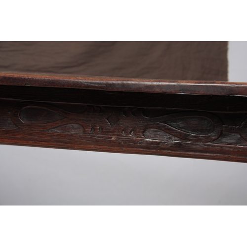 1295 - AN EARLY 18TH CENTURY OAK REFECTORY TABLE with plank top above a carved blind fret frieze; standing ... 