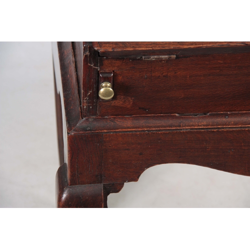 1297 - AN 18TH CENTURY OAK BUREAU ON STAND with hinged angled fall fitted with three iron locks having bras... 