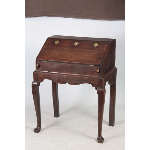 1297 - AN 18TH CENTURY OAK BUREAU ON STAND with hinged angled fall fitted with three iron locks having bras... 