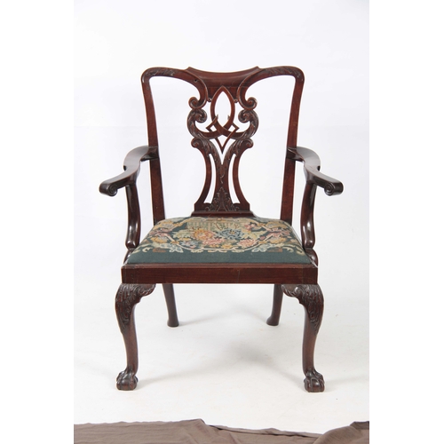 1300 - A GEORGE III CHIPPENDALE STYLE MAHOGANY OPEN ARMCHAIR with scrolled, leaf carved, pierced back splat... 