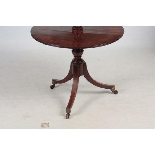 1301 - A GEORGE III MAHOGANY TWO TEIR FOLDING DUMB WAITER IN THE MANER OF GILLOWS having two circular shelv... 