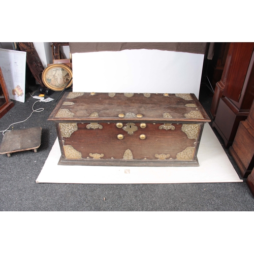 1302 - AN 18TH CENTURY ANGLO INDIAN BRASS MOUNTED HARDWOOD CHEST ON STAND with elaborate engraved pierced b... 