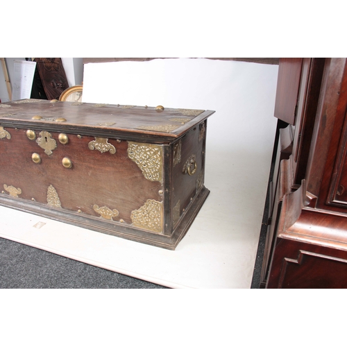 1302 - AN 18TH CENTURY ANGLO INDIAN BRASS MOUNTED HARDWOOD CHEST ON STAND with elaborate engraved pierced b... 