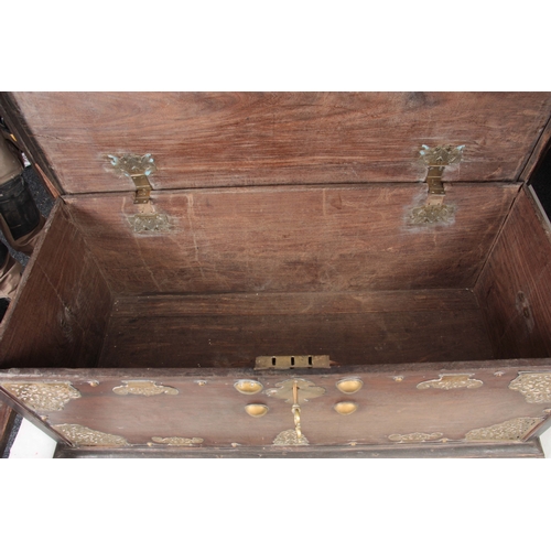 1302 - AN 18TH CENTURY ANGLO INDIAN BRASS MOUNTED HARDWOOD CHEST ON STAND with elaborate engraved pierced b... 