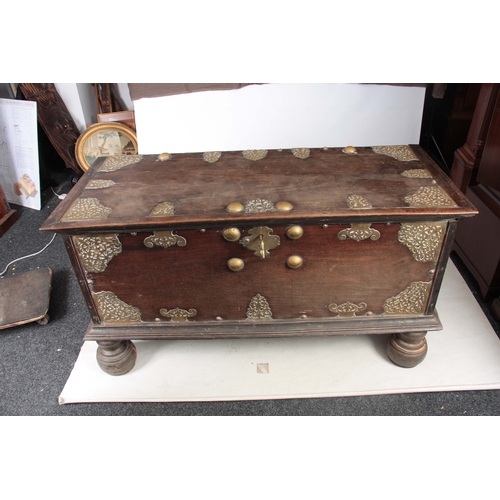 1302 - AN 18TH CENTURY ANGLO INDIAN BRASS MOUNTED HARDWOOD CHEST ON STAND with elaborate engraved pierced b... 