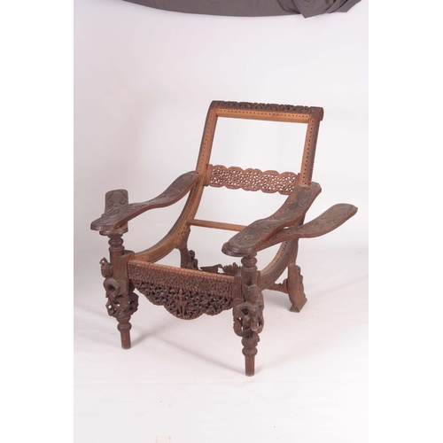 1304 - AN UNUSUAL EARLY/MID 19TH CENTURY EASTERN/SOUTH SEAS RECLINING LOUNGE CHAIR with swivelling underarm... 