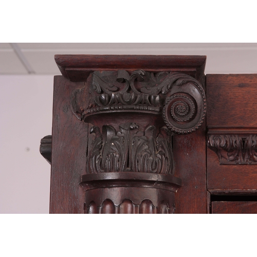 1306 - AN IMPRESSIVE 18TH CENTURY ARCHITECTURAL OAK HALL CUPBOARD with fluted corinthian side columns, hing... 