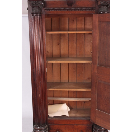 1306 - AN IMPRESSIVE 18TH CENTURY ARCHITECTURAL OAK HALL CUPBOARD with fluted corinthian side columns, hing... 