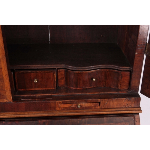 1307 - A LATE 17TH / EARLY 18TH CENTURY HERRING BAND STRUNG FIGURED WALNUT BUREAU BOOKCASE of narrow propor... 