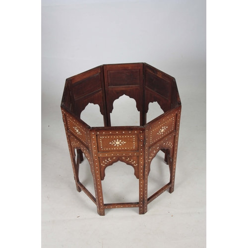 1257 - A 19TH CENTURY OCTAGONAL ANGLO INDIAN OCCASIONAL TABLE INLAID WITH BONE AND EBONY standing on a fold... 