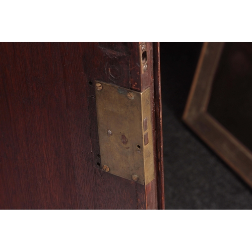 1308 - A MID 18TH CENTURY OAK HALL CUPBOARD with moulded cornice above a pair of arched fielded panel doors... 