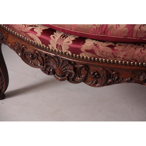 1312 - A FINE PAIR OF 18TH CENTURY FRENCH ROCOCO CARVED WALNUT OPEN ARMCHAIRS  with upholstered shaped back... 