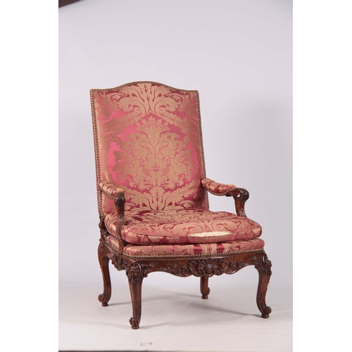 1312 - A FINE PAIR OF 18TH CENTURY FRENCH ROCOCO CARVED WALNUT OPEN ARMCHAIRS  with upholstered shaped back... 