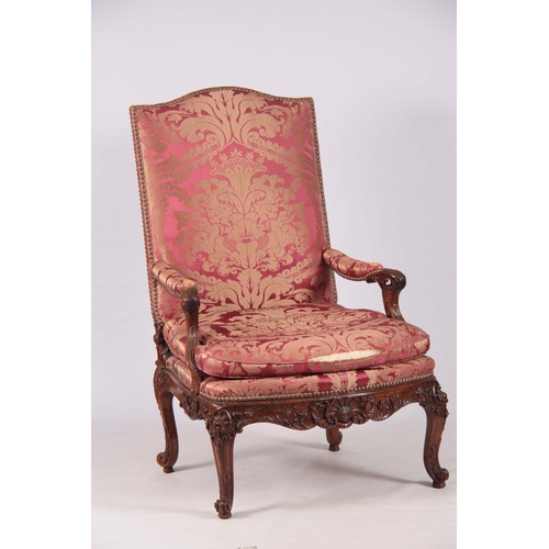 1312 - A FINE PAIR OF 18TH CENTURY FRENCH ROCOCO CARVED WALNUT OPEN ARMCHAIRS  with upholstered shaped back... 