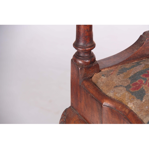 1313 - A 19TH CENTURY GEORGE I STYLE WALNUT CORNER CHAIR with carved eagles head top rail above solid shape... 