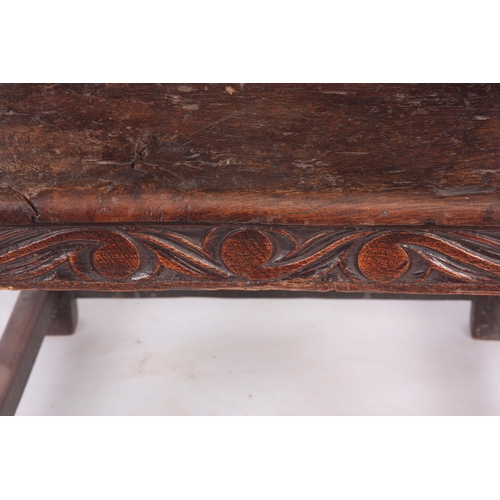 1317 - A 17TH CENTURY AND LATER OAK WAINSCOT CHAIR with eared shaped carved top rail centred  by an arched ... 