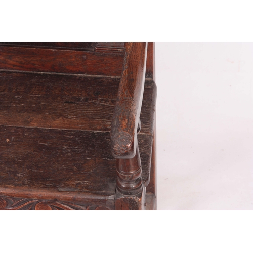 1317 - A 17TH CENTURY AND LATER OAK WAINSCOT CHAIR with eared shaped carved top rail centred  by an arched ... 