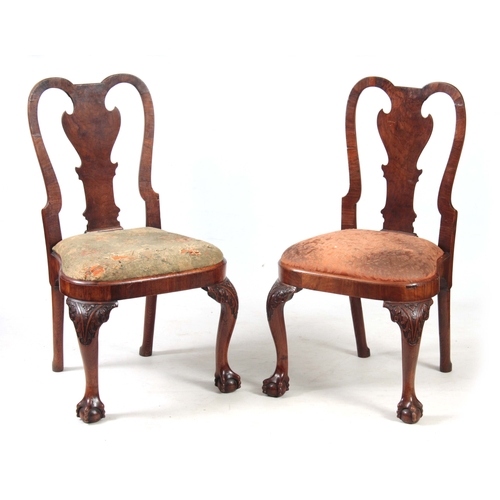 1319 - A PAIR OF GEORGE I WALNUT SIDE CHAIRS with shaped backs and drop-in seats; standing on carved cabrio... 