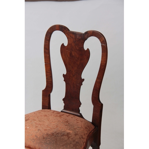 1319 - A PAIR OF GEORGE I WALNUT SIDE CHAIRS with shaped backs and drop-in seats; standing on carved cabrio... 