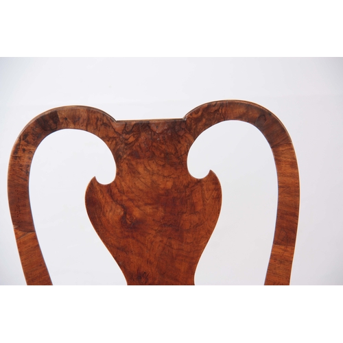 1319 - A PAIR OF GEORGE I WALNUT SIDE CHAIRS with shaped backs and drop-in seats; standing on carved cabrio... 