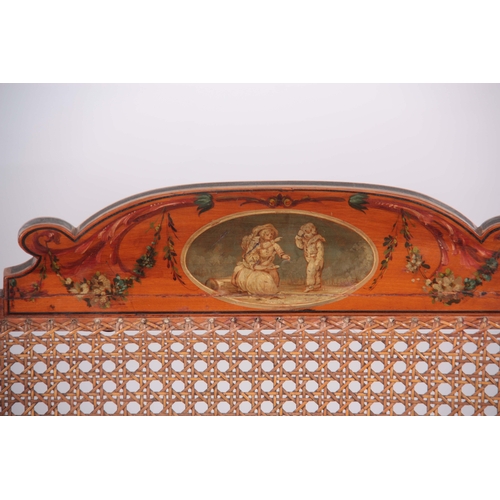 1320 - A 19TH CENTURY ADAM STYLE PAINTED SATINWOOD BERGERE THREE SEATER SETTEE with painted floral urns - b... 