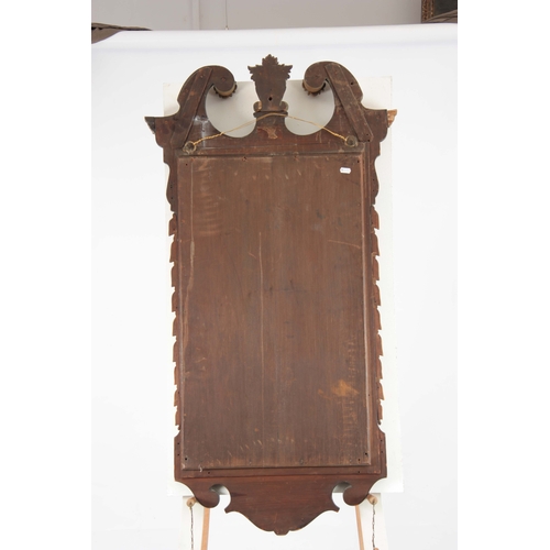 1323 - A GEORGE II STYLE MAHOGANY AND GILT WORK HANGING MIRROR with swan neck top above a carved mahogany f... 