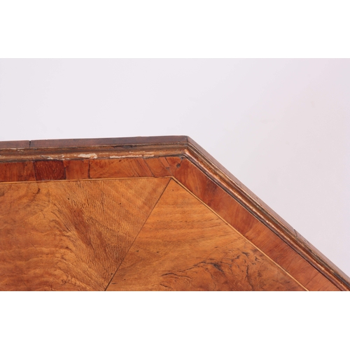 1325 - A GEORGE III OCTAGONAL SHAPED TILT TOP TABLE with figured and burr Elm segmented top; standing on an... 