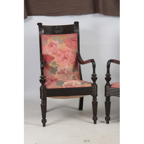 1328 - A PAIR OF 19TH CENTURY SOLID EBONY ANGLO INDIAN ARMCHAIRS with reeded shell carved back joined by sh... 