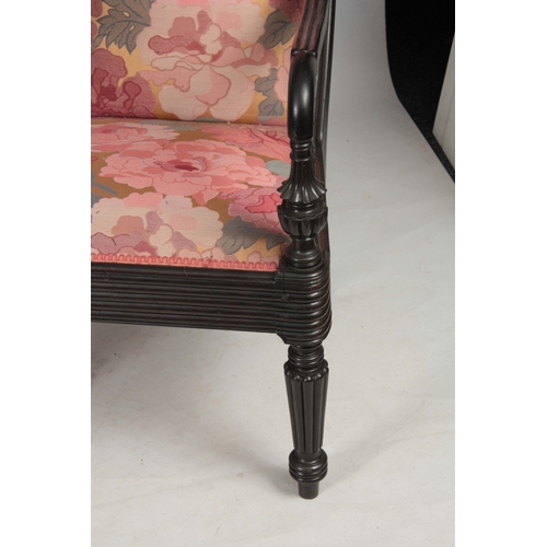 1328 - A PAIR OF 19TH CENTURY SOLID EBONY ANGLO INDIAN ARMCHAIRS with reeded shell carved back joined by sh... 