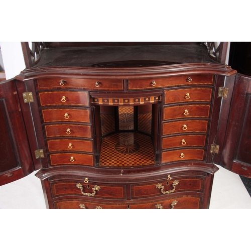 1331 - AN UNUSUAL SERPENTINE THREE TIER CABINET ON CHEST IN MANNER OF CHIPPENDALE with a two-tier fret cut ... 