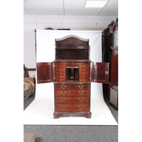 1331 - AN UNUSUAL SERPENTINE THREE TIER CABINET ON CHEST IN MANNER OF CHIPPENDALE with a two-tier fret cut ... 